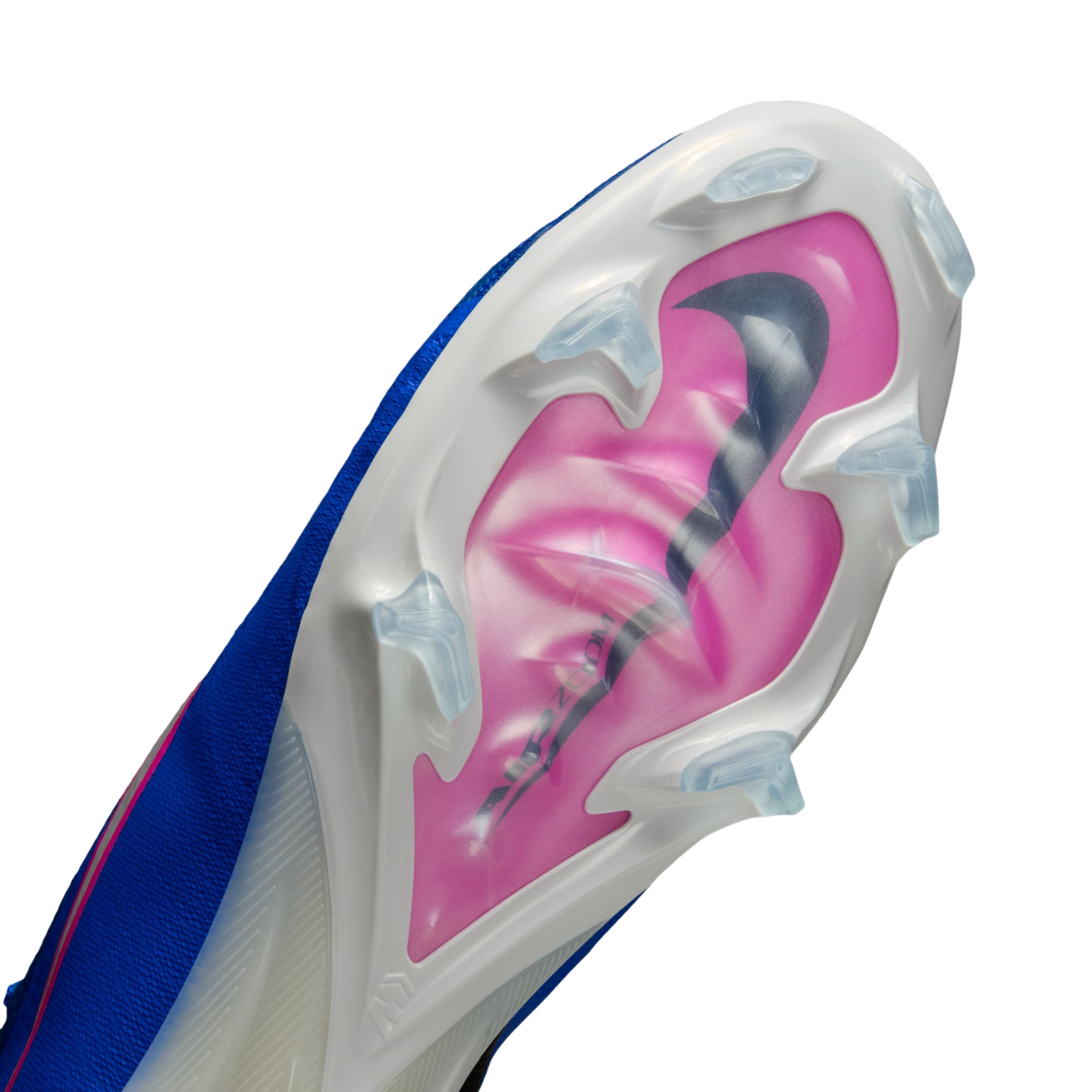 Close-up of the sole of a white and blue Nike soccer cleat featuring a pink "Air Zoom" plate and translucent studs against a black background.