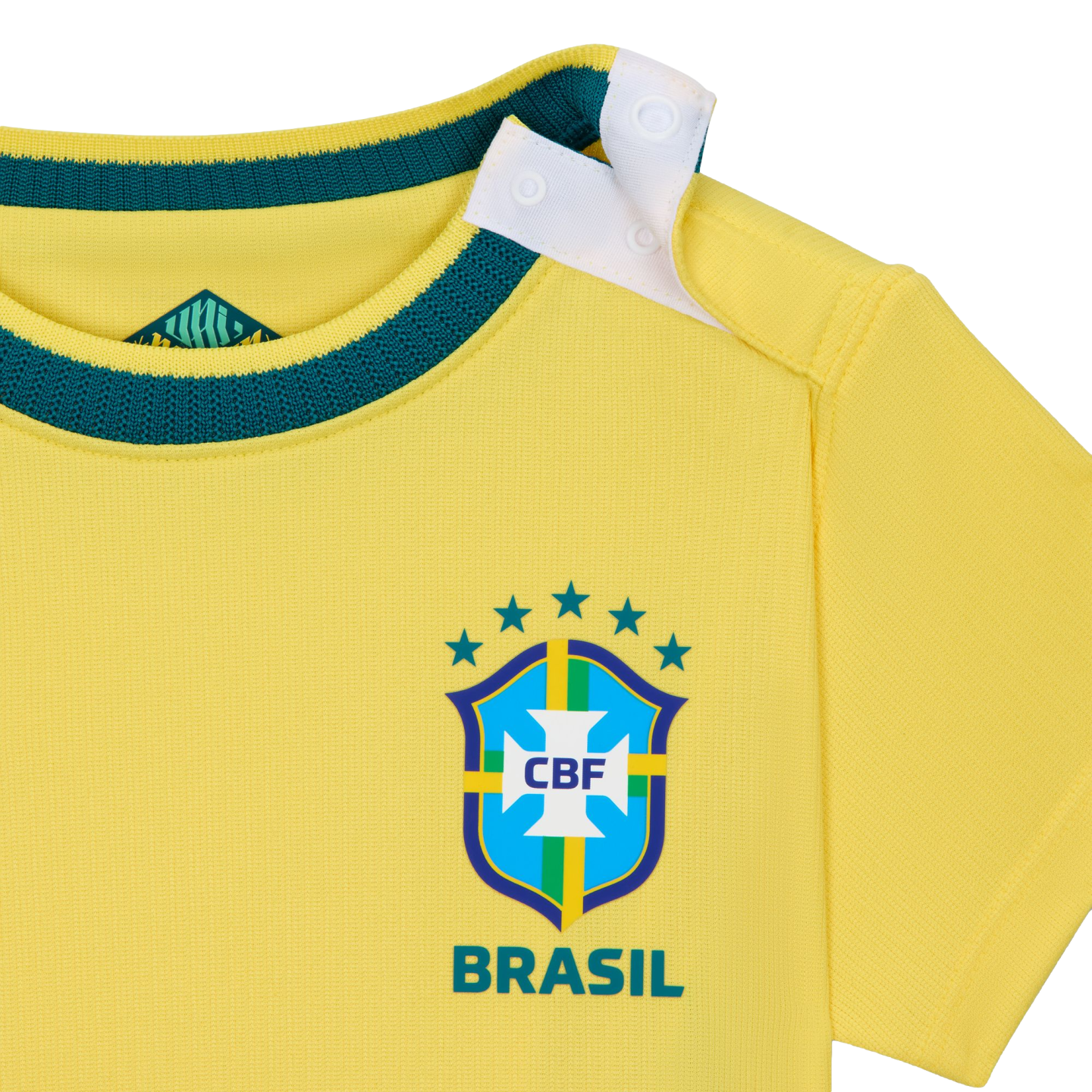 A close-up shot of a bright yellow baby-sized Brazil national football team jersey. It features a dark green ribbed neckline and a white snap-button opening on the shoulder. The official CBF crest is printed on the front with five green stars above it and the word "BRASIL" in green below.