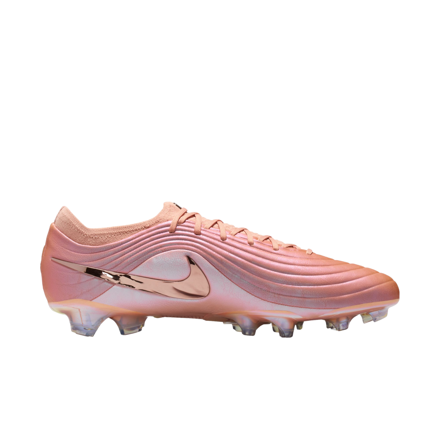 Side profile of a pink Nike soccer cleat featuring a metallic rose gold swoosh and a rippled, textured upper against a black background.