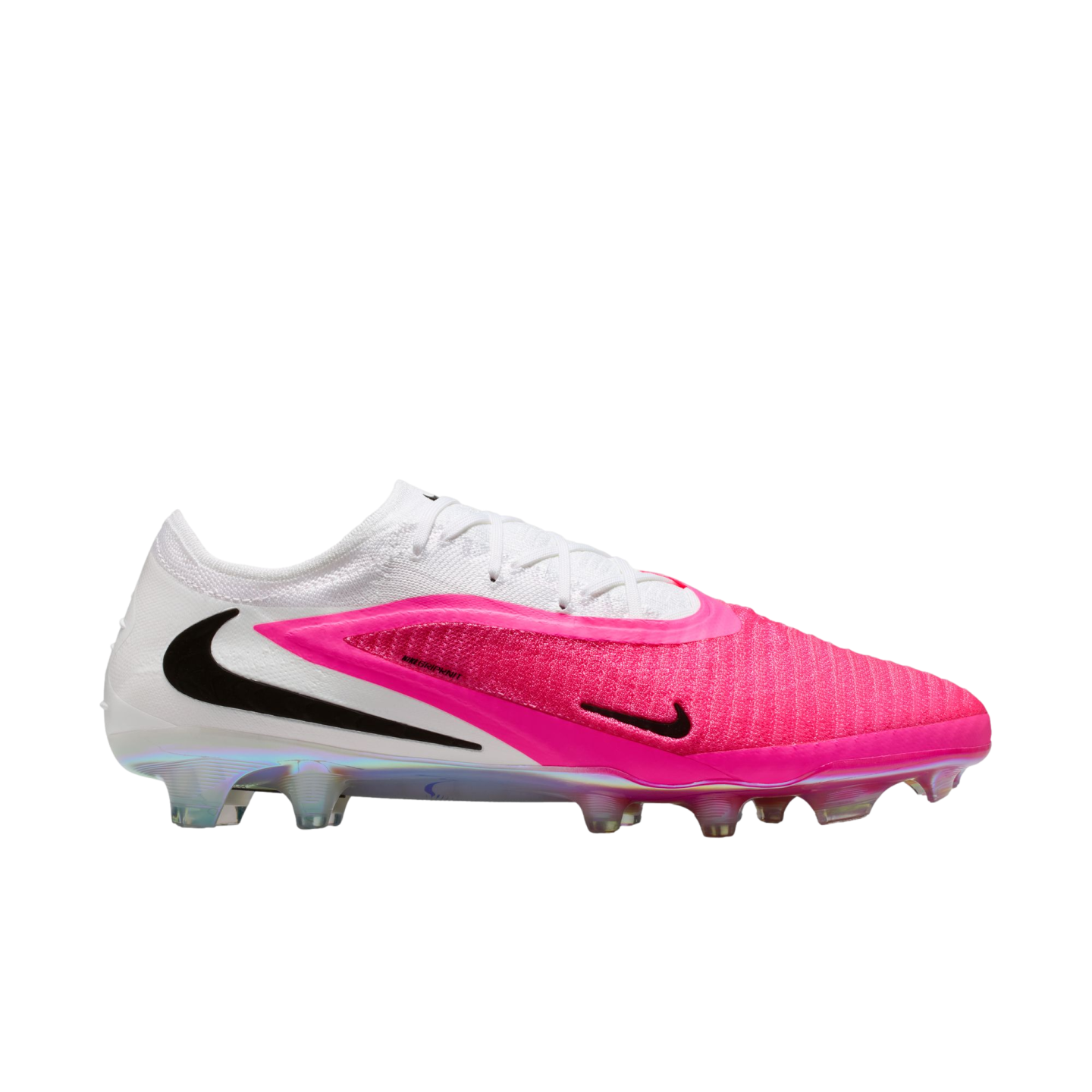 Side profile of a white and vibrant pink Nike soccer cleat with black Swoosh logos and an iridescent studded sole, isolated on a white background.