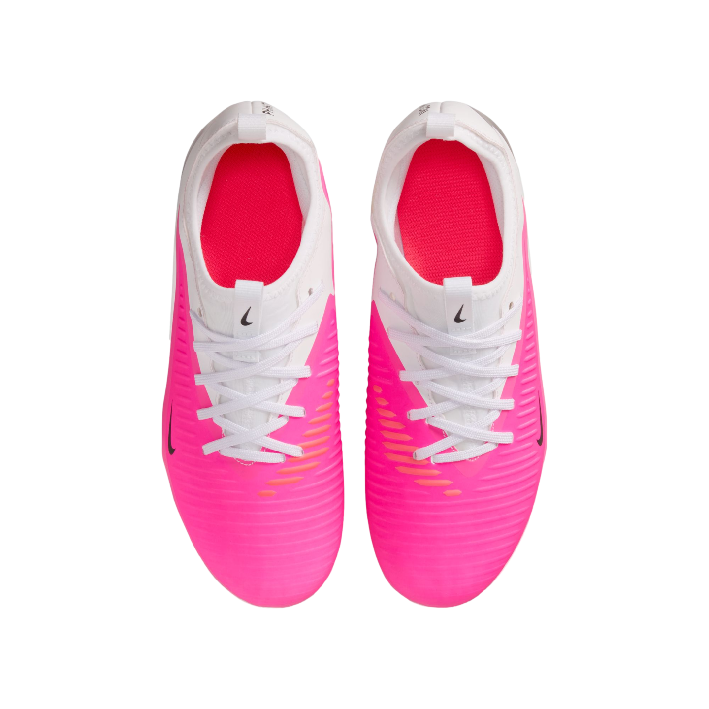 A top-down view of a pair of bright pink and white Nike soccer cleats with white laces, set against a plain white background.