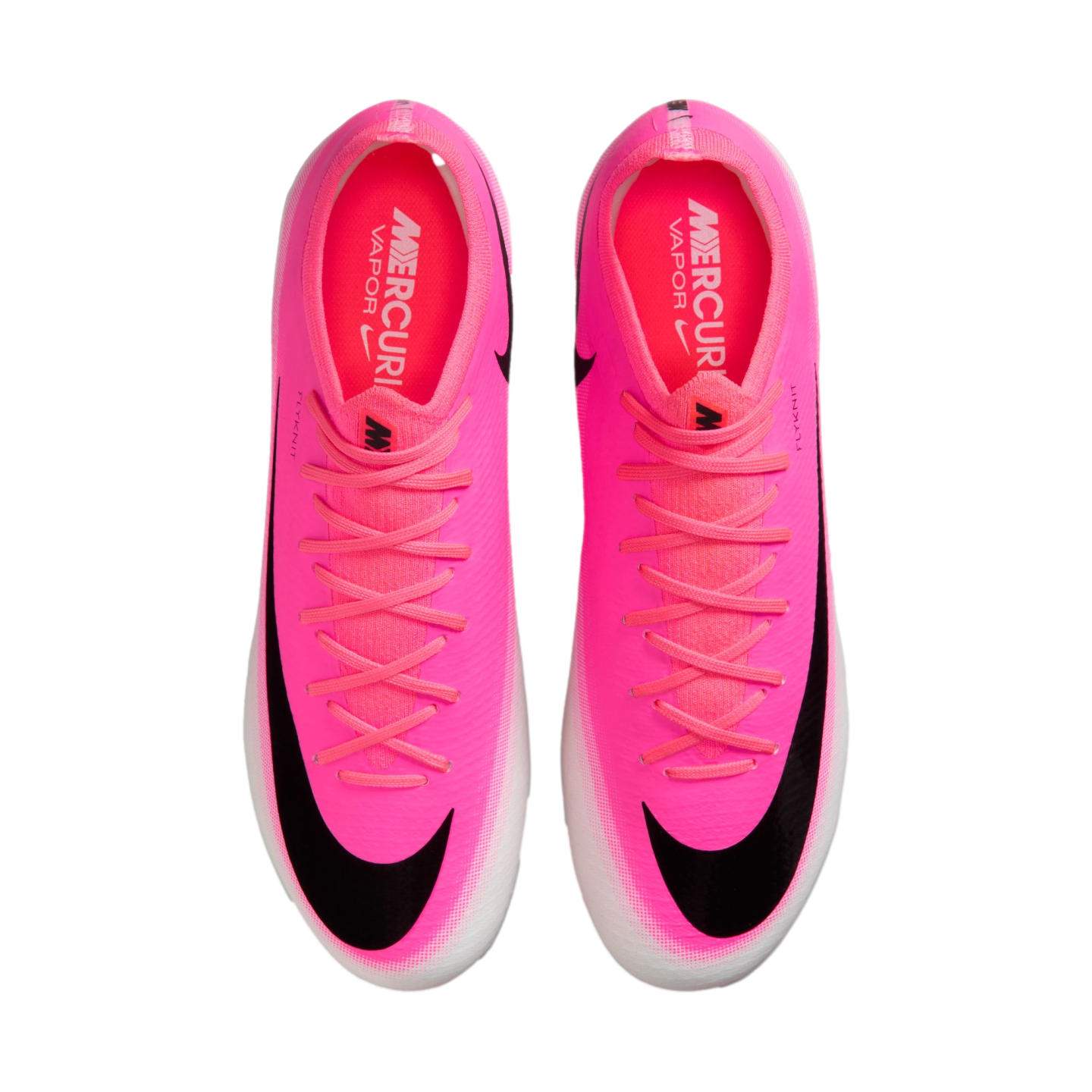 Top-down view of a pair of bright pink Nike Mercurial soccer cleats with black swooshes and white soles, isolated on a white background.