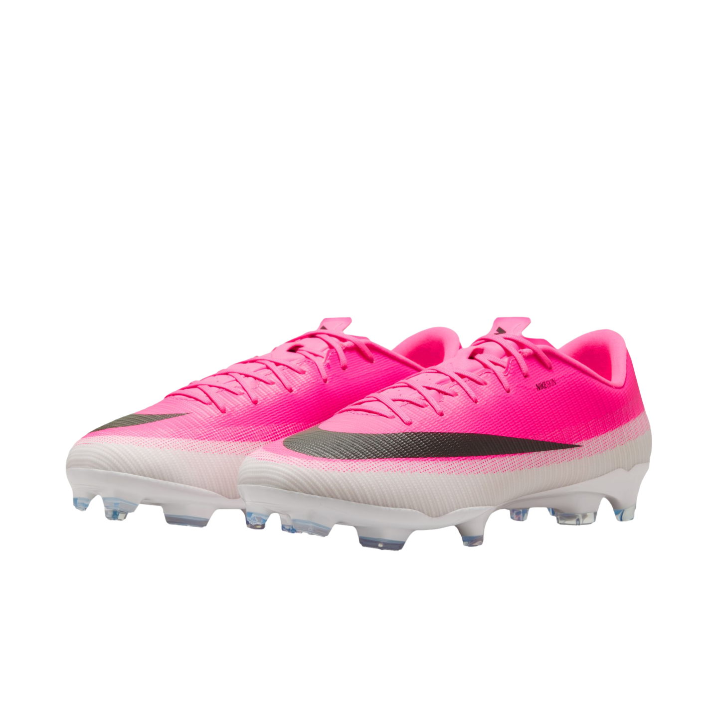 A pair of bright pink and white Nike soccer cleats featuring a prominent black swoosh and a white studded soleplate.