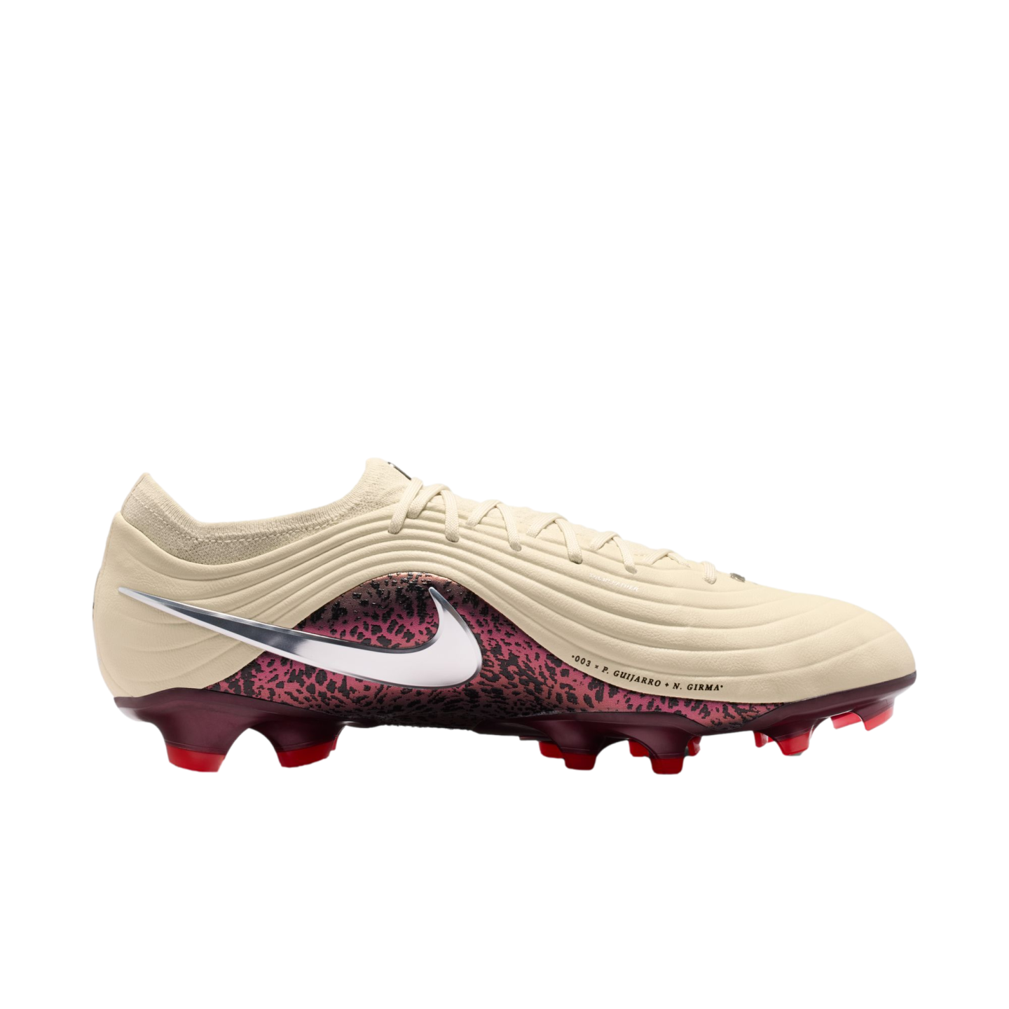 A profile view of a Nike soccer cleat against a solid black background. The upper part of the boot is a textured, off-white cream color with wavy lines. A large metallic silver swoosh is prominently displayed on the side, overlapping a burgundy section with black animal-print spots. The cleat features a burgundy soleplate with bright red studs. Small black text on the side reads ".003 x P. GUIJARRO + N. GIRMA".
