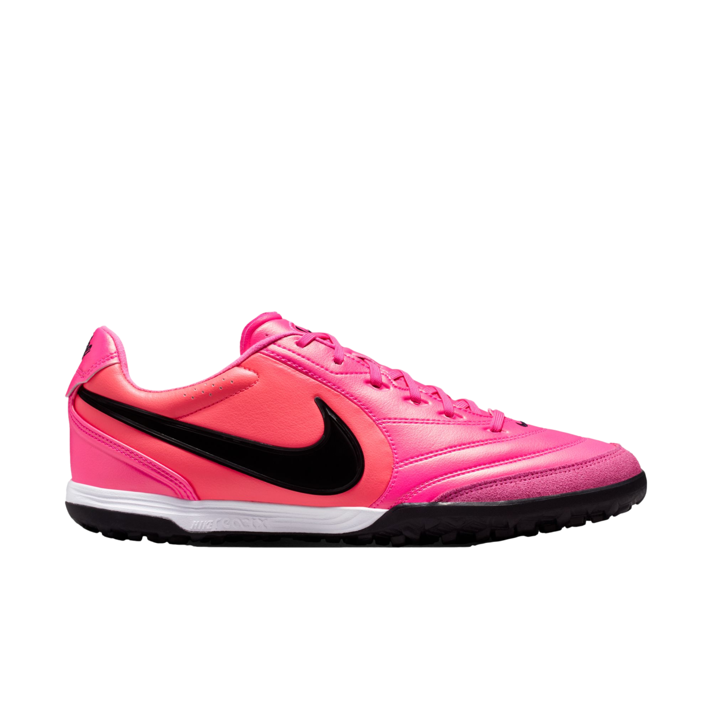 Side view of a bright pink Nike turf soccer shoe with a black Swoosh, white midsole, and black studded outsole.