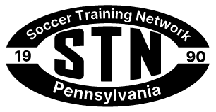 Black and white oval logo for Soccer Training Network, Pennsylvania. Features large "STN" in the center with "19" and "90" on the sides, and the full name and state in the border.