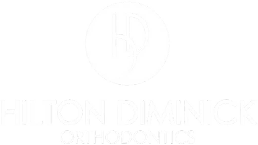 A logo for Hilton Diminick Orthodontics on a solid black background. At the top, a white circle contains a stylized, interlocking black "HD" monogram. Below the circle, the words "HILTON DIMINICK" are written in a large, bold, white, sans-serif font. Underneath that, the word "ORTHODONTICS" appears in a smaller, thinner, white, sans-serif font.