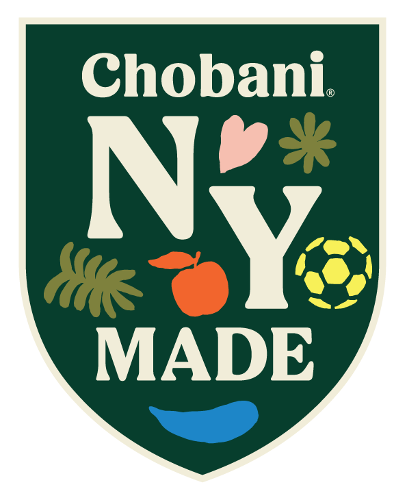 Green shield badge featuring the text "Chobani NY MADE" alongside colorful icons of a heart, flower, leaf, apple, soccer ball, and a blue wave.