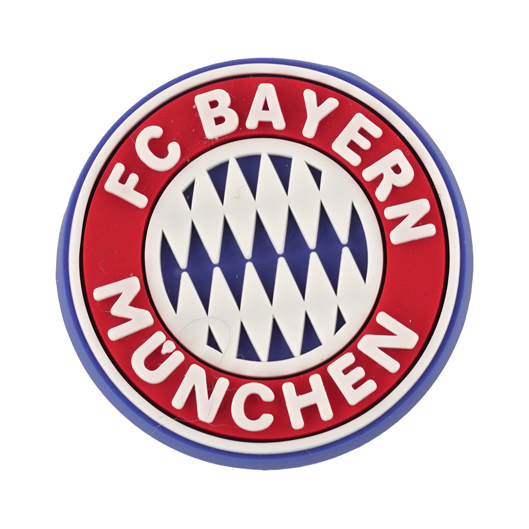 Round rubber logo charm for FC Bayern München, featuring a red outer ring with white text and a blue and white diamond pattern at the center.