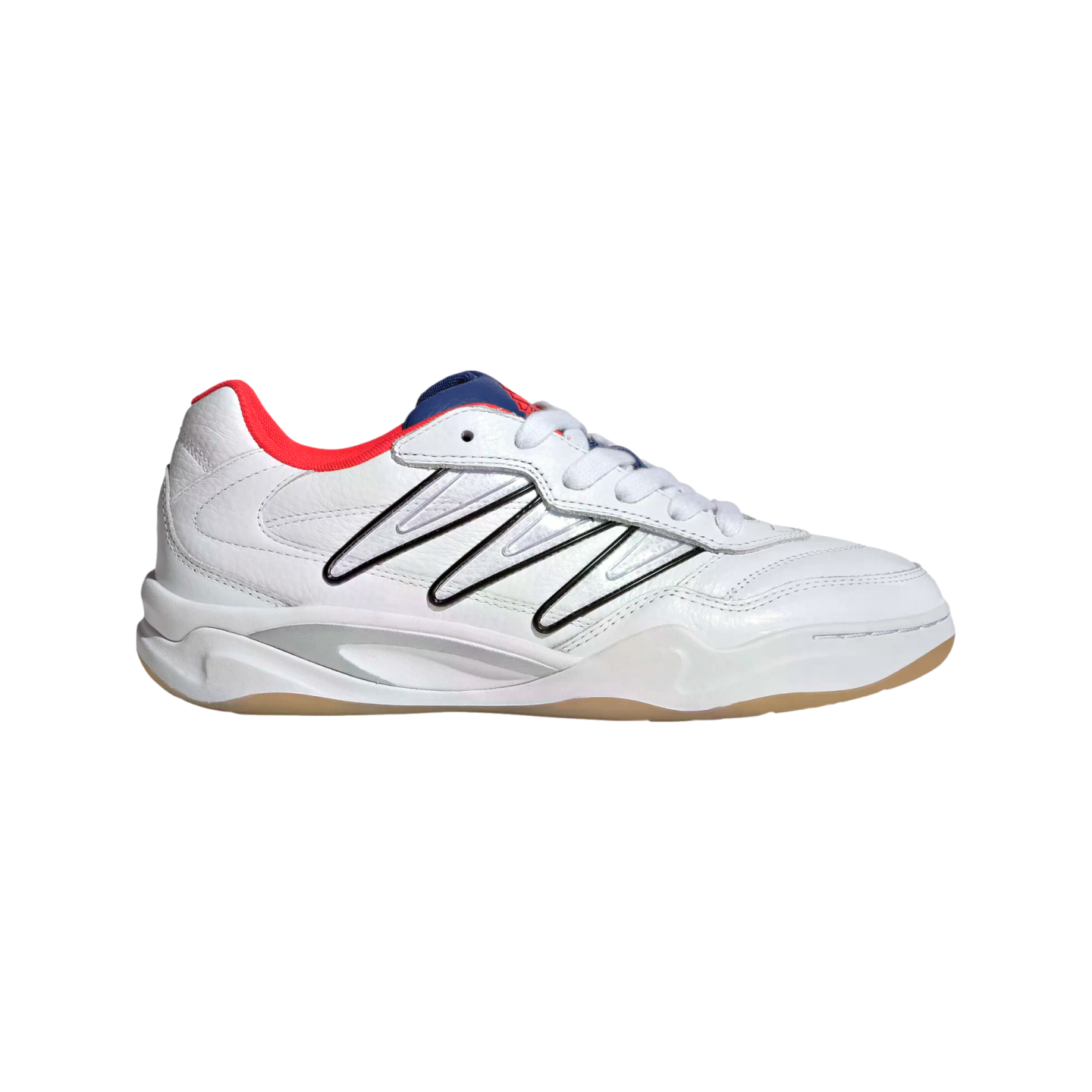White sneaker with black diagonal stripes, a red collar, navy blue tongue, and gum outsole against a black background.