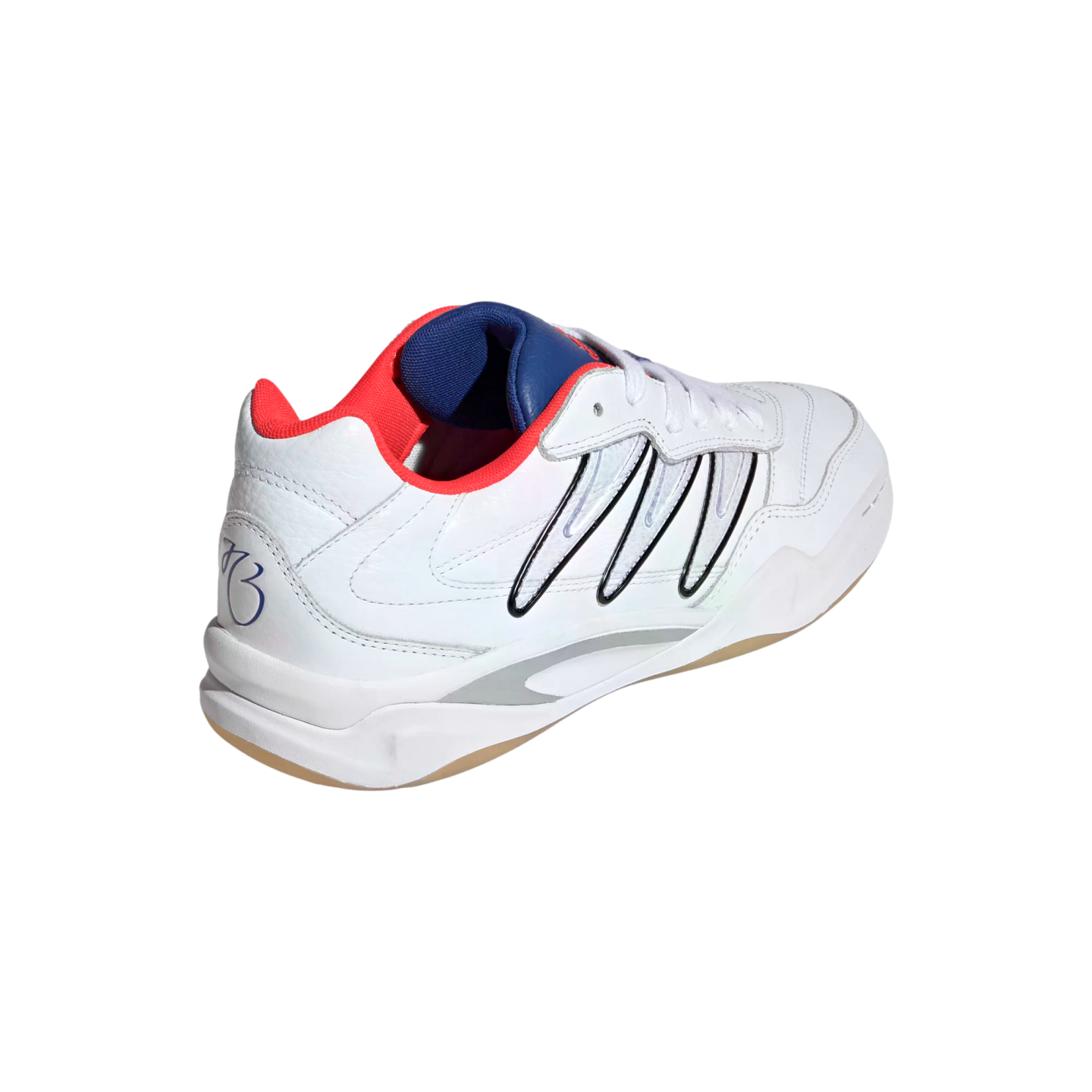 White low-top sneaker with black curved side stripes, red and blue interior accents, and a gum sole, shown from a rear-quarter perspective on a black background.