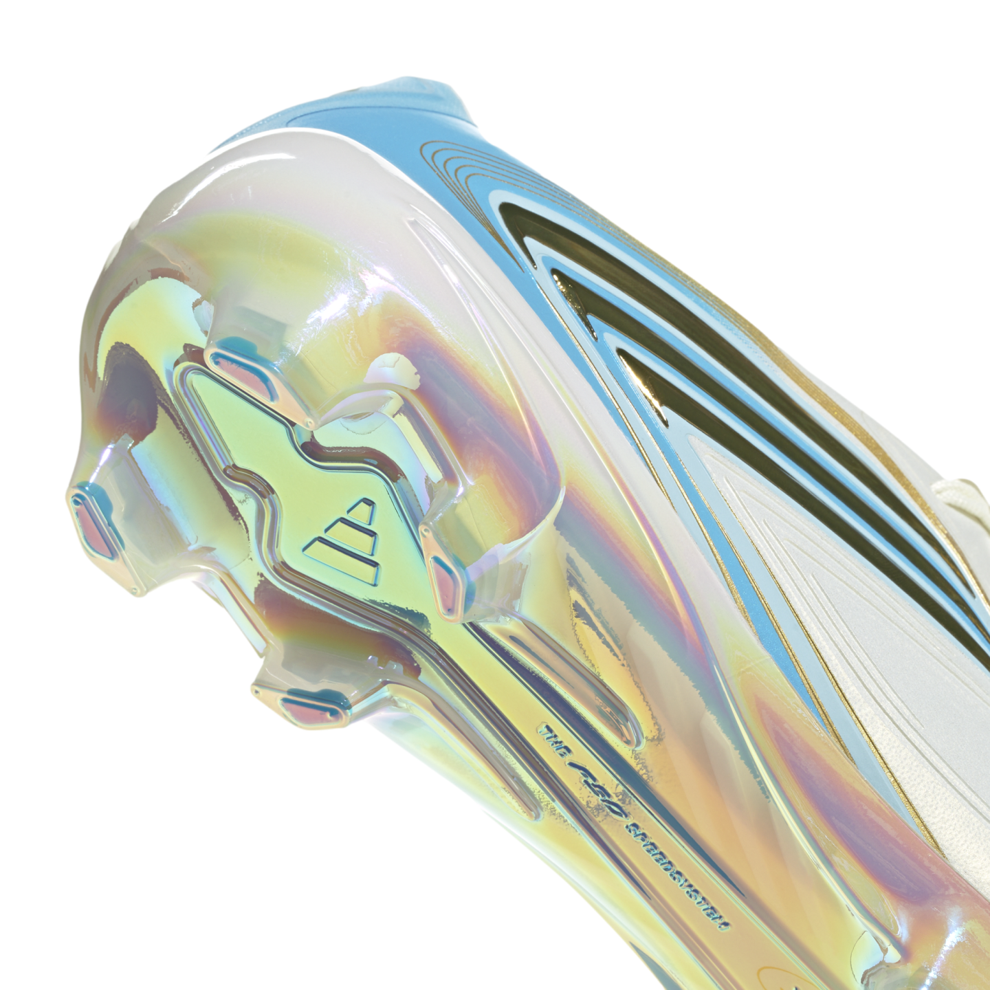 Close-up of the iridescent, pearlescent soleplate of a soccer cleat, featuring angular studs and light blue and gold accents.