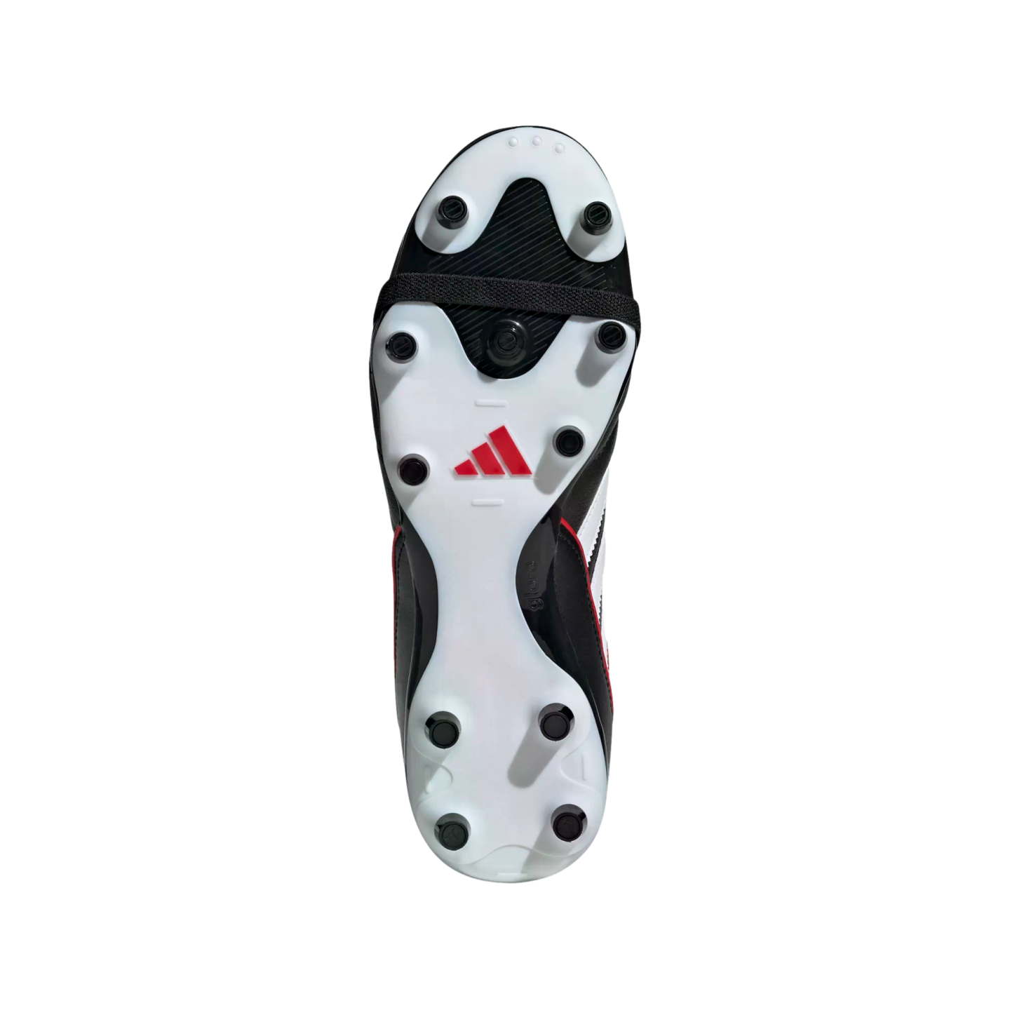 Underside of a white and black Adidas soccer cleat with several circular studs, a red logo in the center, and a black midfoot strap.
