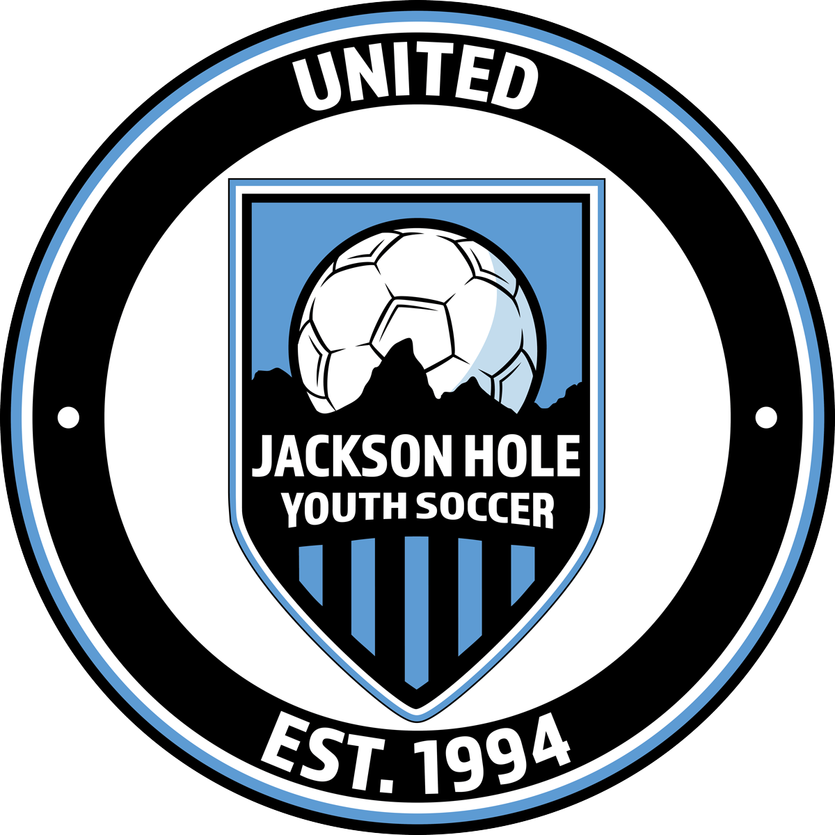 Circular logo for Jackson Hole Youth Soccer United, Est. 1994. Shield features a soccer ball over a mountain silhouette and light blue and black vertical stripes.