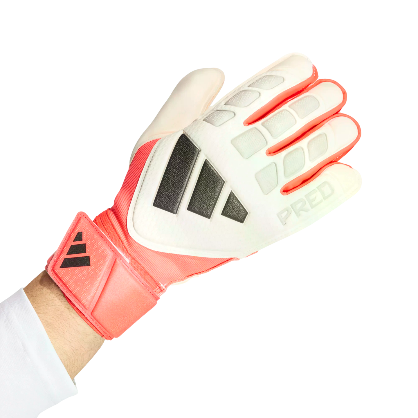 White and coral Adidas Predator goalkeeper glove on a hand, featuring dark grey stripes and a textured backhand, set against a solid black background.