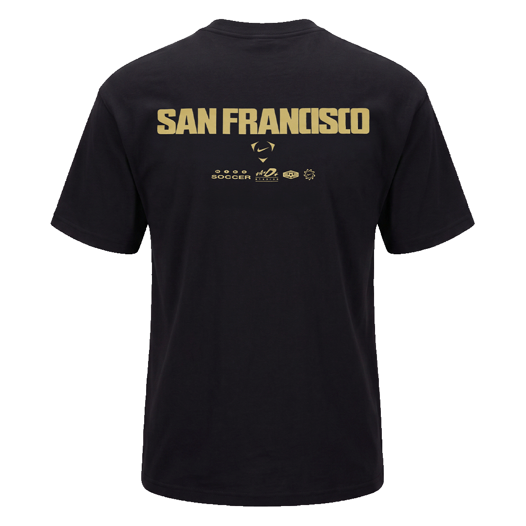 Back of a black t-shirt with "SAN FRANCISCO" in bold gold lettering across the upper back and smaller gold branding logos centered underneath.