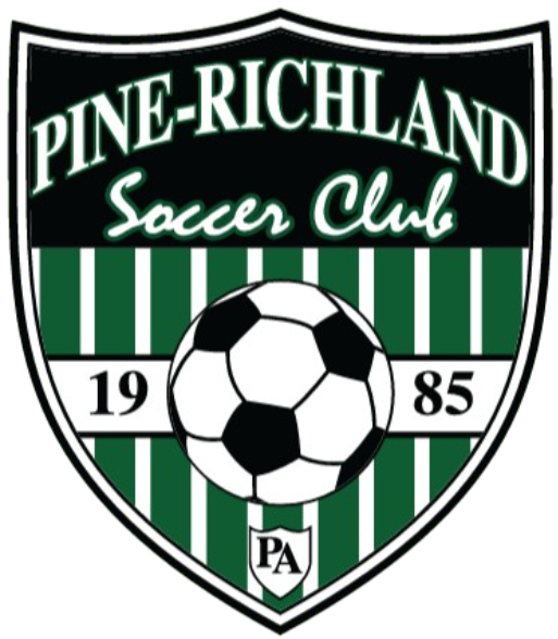 Shield-shaped logo for Pine-Richland Soccer Club featuring a central soccer ball over green and white stripes, the year 1985, and a small PA emblem.