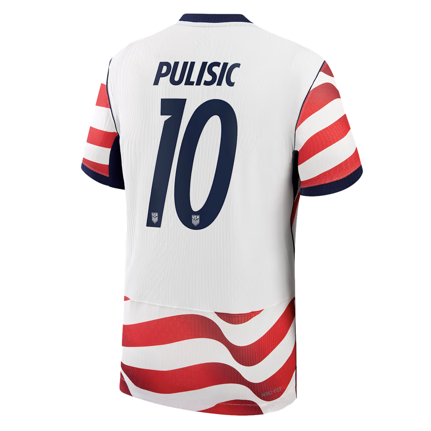A studio shot of the back of a white United States national team soccer jersey with the name "PULISIC" and number "10" in navy blue. The jersey features red and white horizontal stripes on the sleeves and a wavy red and white stripe pattern at the bottom.