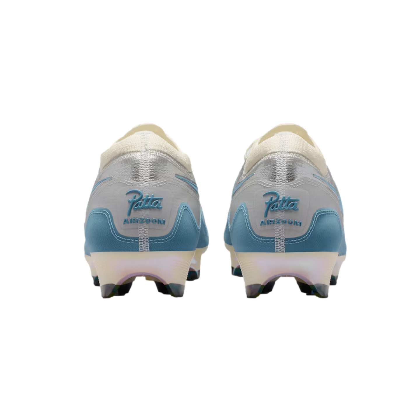 Rear view of two light blue and silver soccer cleats with 'Patta' and 'AIR ZOOM' branding on the heels, shown against a black background.