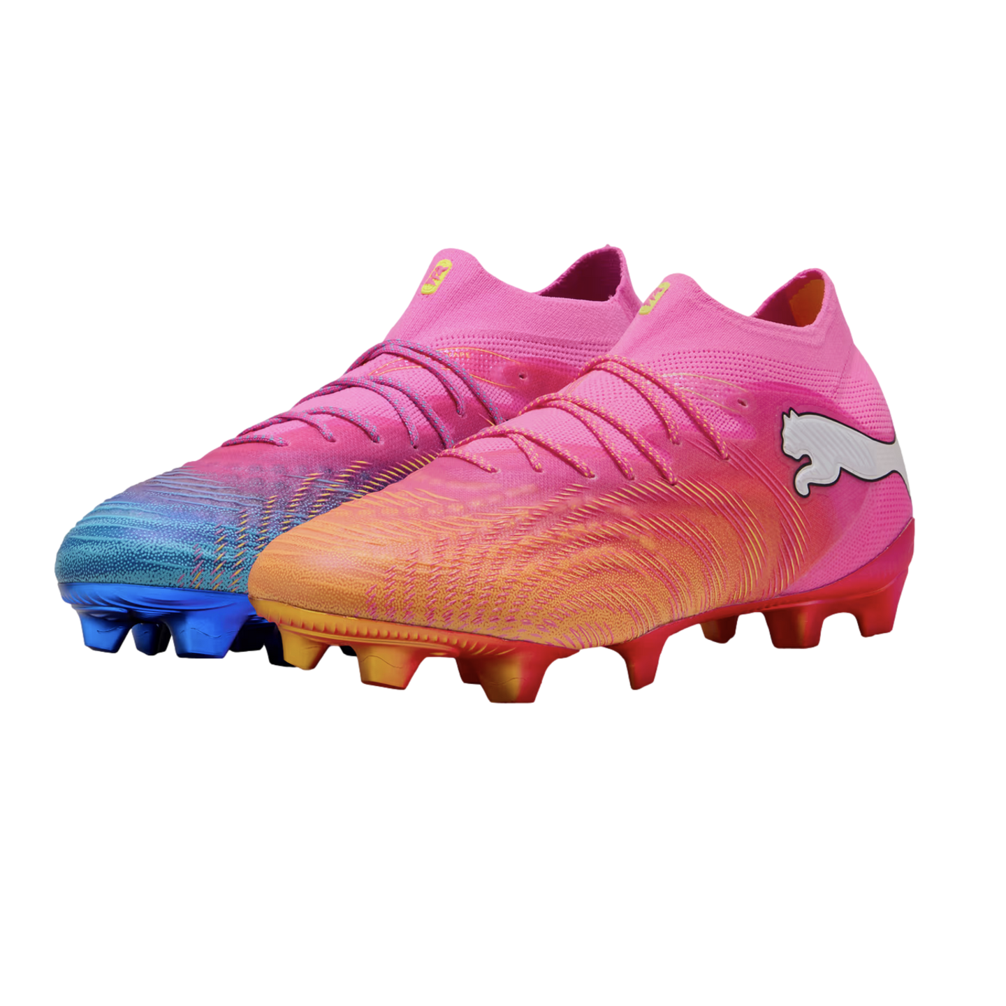 A pair of mismatched pink Puma soccer cleats: one with an orange gradient toe and red studs, the other with a blue gradient toe and blue studs.