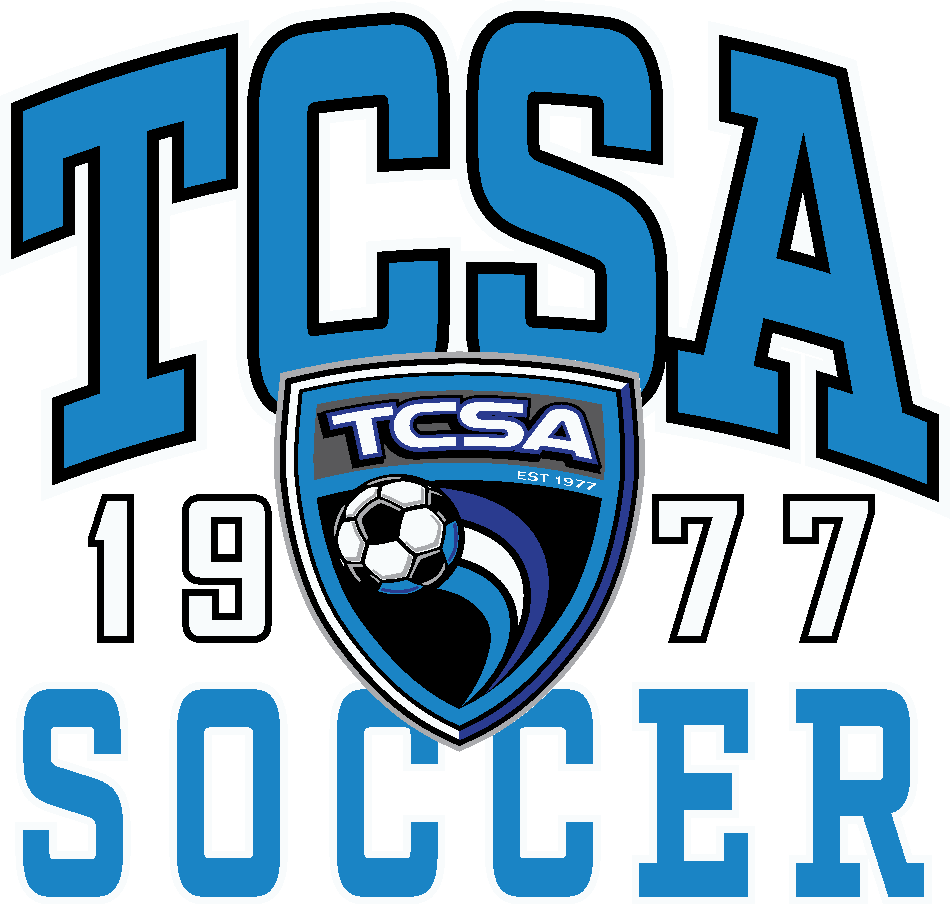 Logo for TCSA Soccer with large blue block letters. A central shield contains a soccer ball, and the year '1977' is split on either side of the shield.