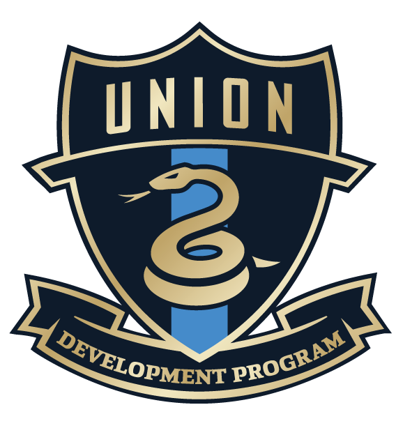 Shield-shaped logo for UNION DEVELOPMENT PROGRAM featuring a coiled gold snake over a light blue vertical stripe on a dark navy background.
