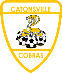 The CAT2 - Catonsville "CREST" POCKET Color logo is a black shield-shaped crest with a yellow border. "CATONSVILLE" is written across the top and "COBRAS" across the bottom in yellow capital letters. The center features a yellow and white cobra poised above a pile of soccer balls.