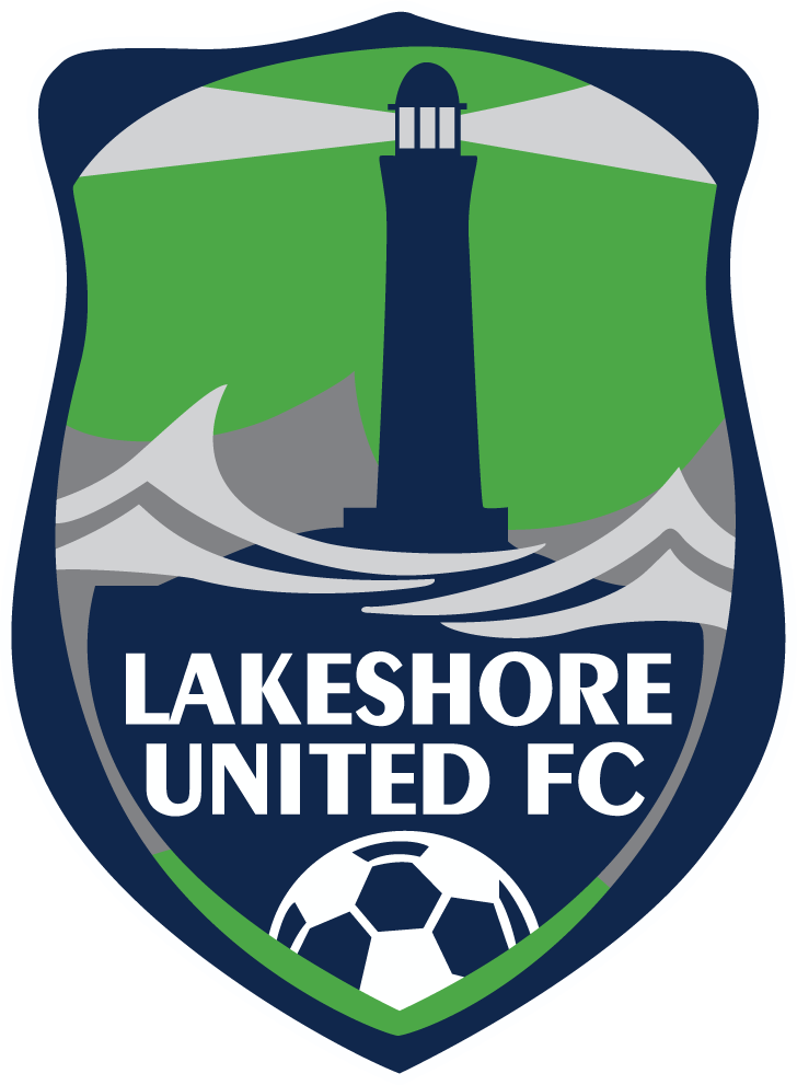 A shield-shaped crest for LSUFC5 - Lakeshore United FC "CREST" POCKET Color, featuring a dark blue lighthouse with grey light beams against a green background, situated above grey stylized waves, the club's name in white text, and a soccer ball at the bottom.