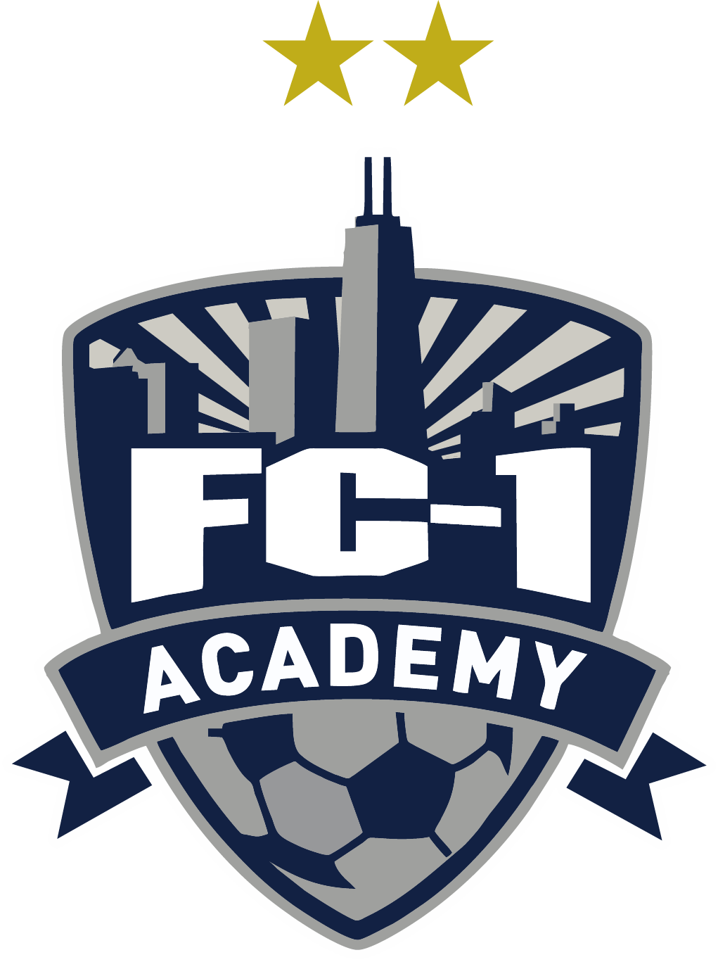 A crest-shaped logo for the FC1 Academy featuring a navy blue and grey color scheme. The design includes two gold stars at the top, a city skyline silhouette with sunburst rays, the bold white text "FC-1 ACADEMY," and a soccer ball pattern at the bottom.