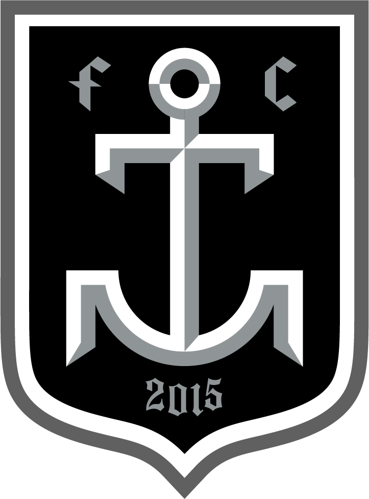 A black shield-shaped emblem for the MKET1 - Milwaukee Torrent "CREST" POCKET Grey features a stylized, beveled grey and white anchor in the center. The lowercase gothic letters "f" and "c" flank the top of the anchor, while the year "2015" is displayed at the bottom in the same font. The crest is outlined with thick white and grey borders.