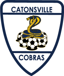 CAT1 - Catonsville "CREST" POCKET Color: A navy blue shield logo featuring the text "CATONSVILLE" at the top and "COBRAS" at the bottom, with a blue and yellow cobra coiled atop several soccer balls in the center.
