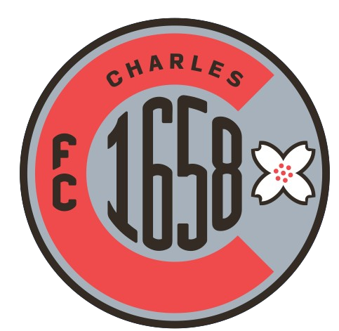 FCC Crest: A circular grey and red logo featuring a large red letter "C" framing the word "CHARLES" and the number "1658". It includes the letters "FC" on the left and a white four-petaled flower on the right.