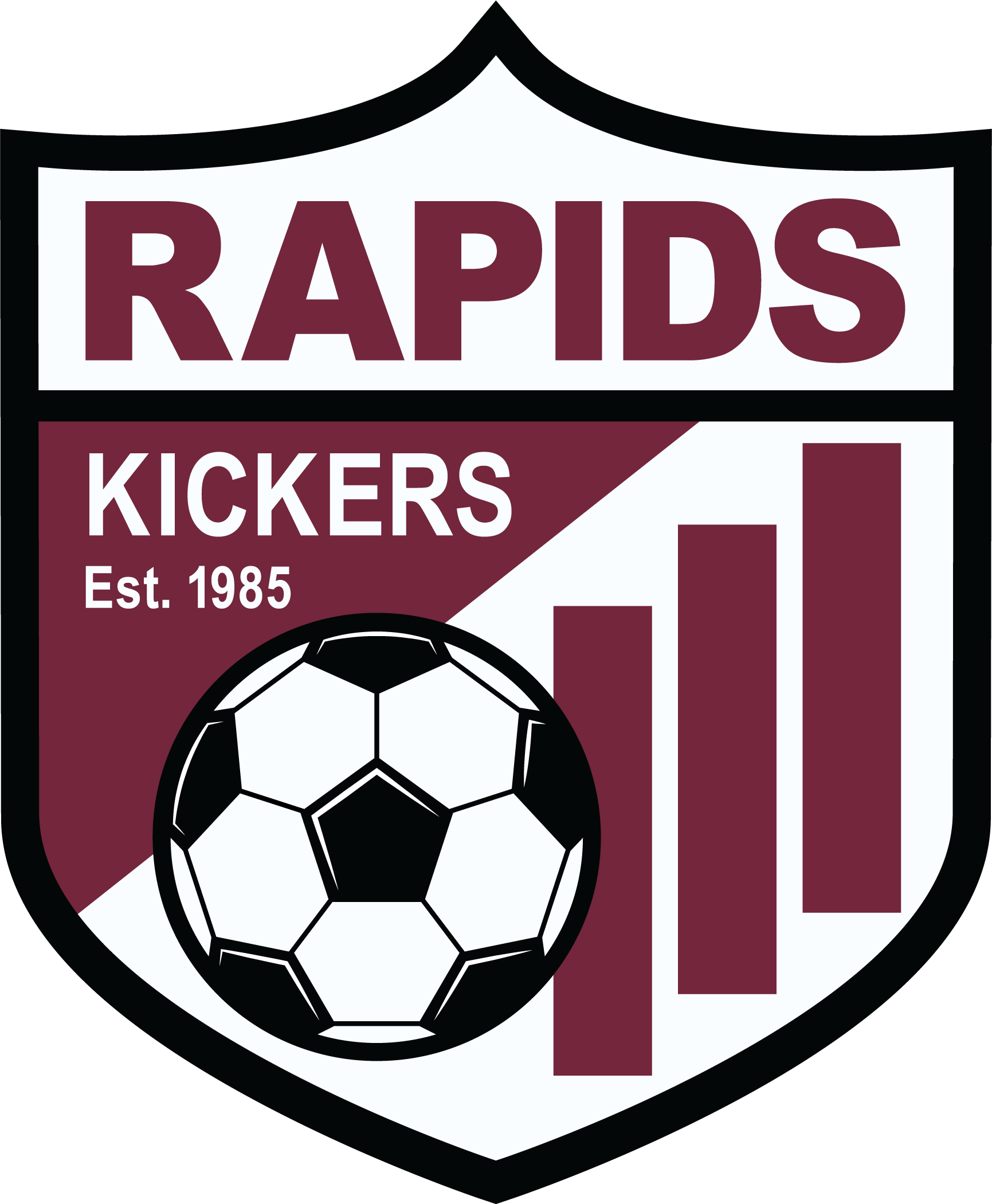 RAPID1 - Rapids Kickers "CREST" FULL Color. A shield-shaped sports logo featuring the word "RAPIDS" in maroon across the top. The bottom section is maroon with the word "KICKERS" and "Est. 1985" in white, alongside a black and white soccer ball and three vertical maroon bars. The entire crest is outlined with a thick black border.