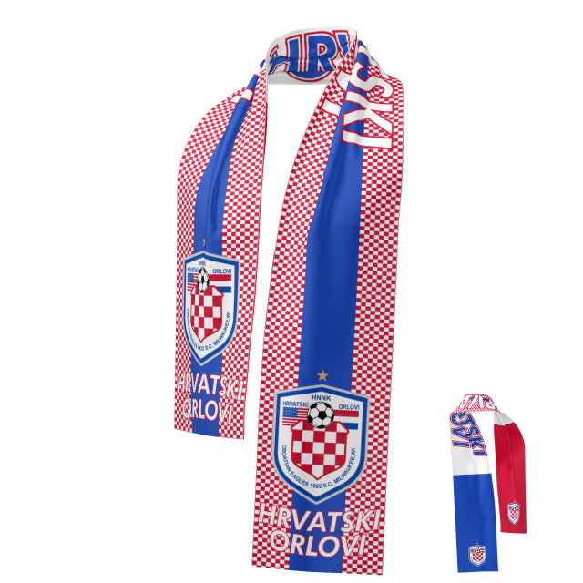A Denver Reversible Scarf for the Croatian Eagles soccer club. The main side features a red and white checkerboard pattern with a vertical blue stripe, the club's crest, and "Hrvatski Orlovi" text. A smaller inset shows the reverse side with solid blue, white, and red stripes and small logos at the ends.