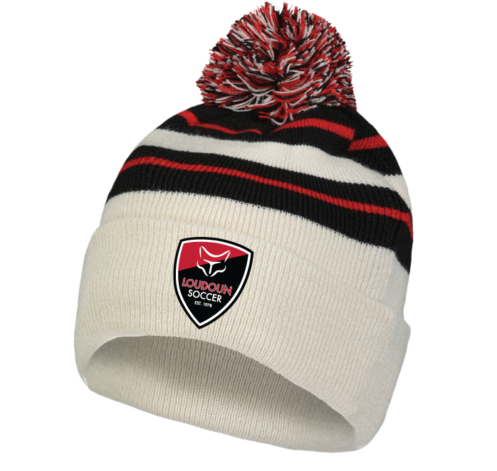 A cream knit beanie with black and red stripes and a multicolored pom-pom. The front cuff features an embroidered shield logo for "Loudoun Soccer" with a fox icon.