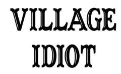 Stylized text reading "VILLAGE IDIOT" in a decorative, black serif font against a white background.