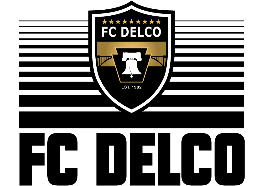 Logo for FC DELCO featuring a black and gold shield with the Liberty Bell inside a Keystone, set against black and white stripes with the club name in large letters below.