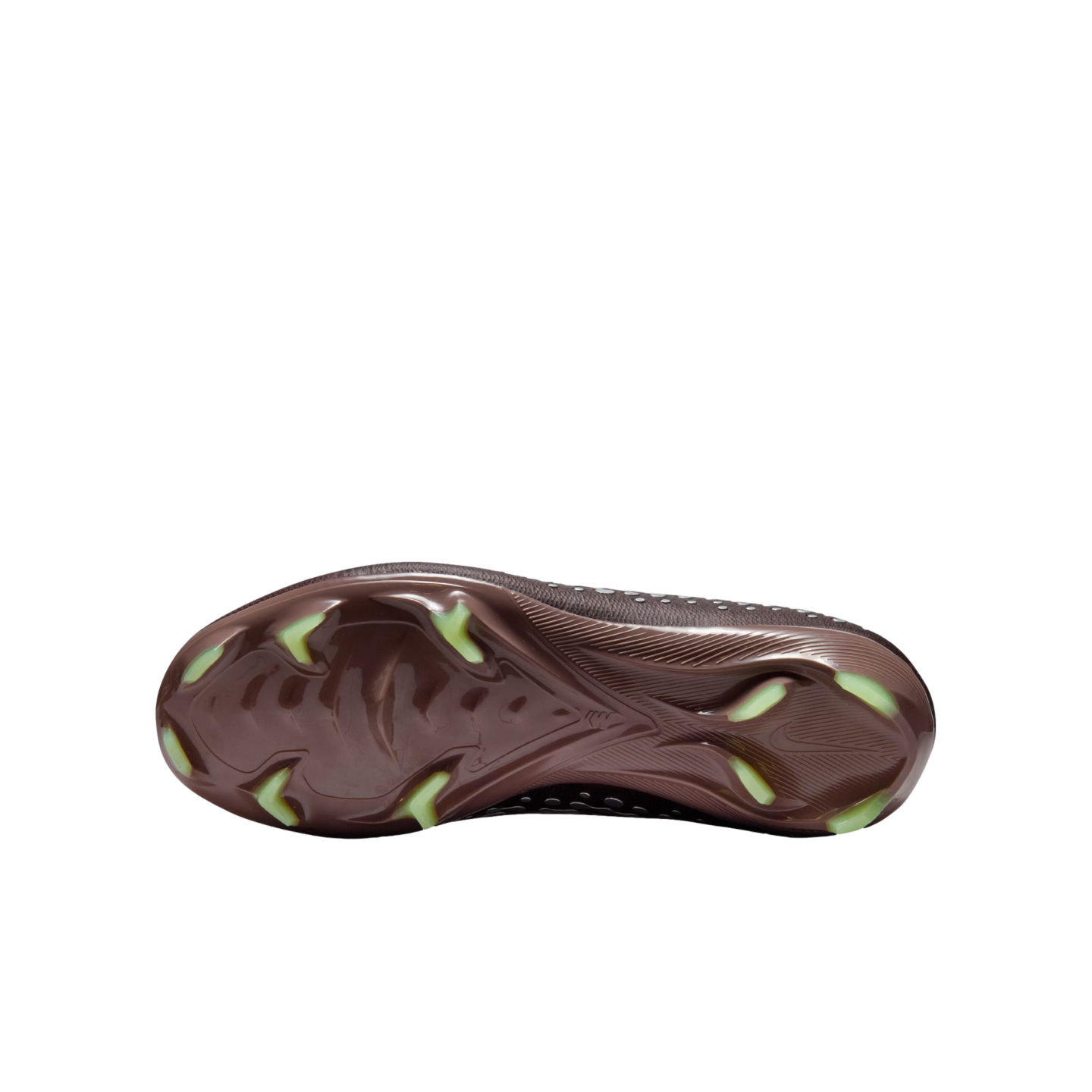 Bottom view of a Nike soccer cleat featuring a metallic brown soleplate with lime green blade-shaped studs, set against a solid black background.