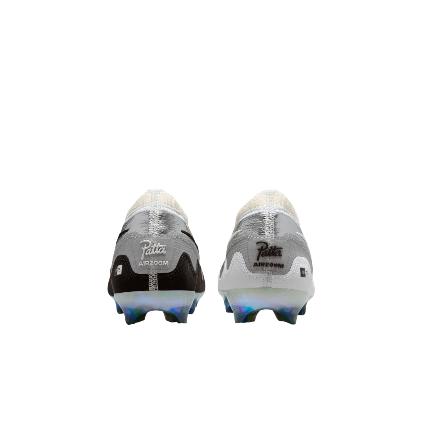 Rear view of a pair of Nike soccer cleats against a solid black background. The left shoe is primarily black and grey, while the right shoe is white and grey. Both feature "Patta" and "AIRZOOM" branding on the heels and iridescent, translucent soleplates with studs.