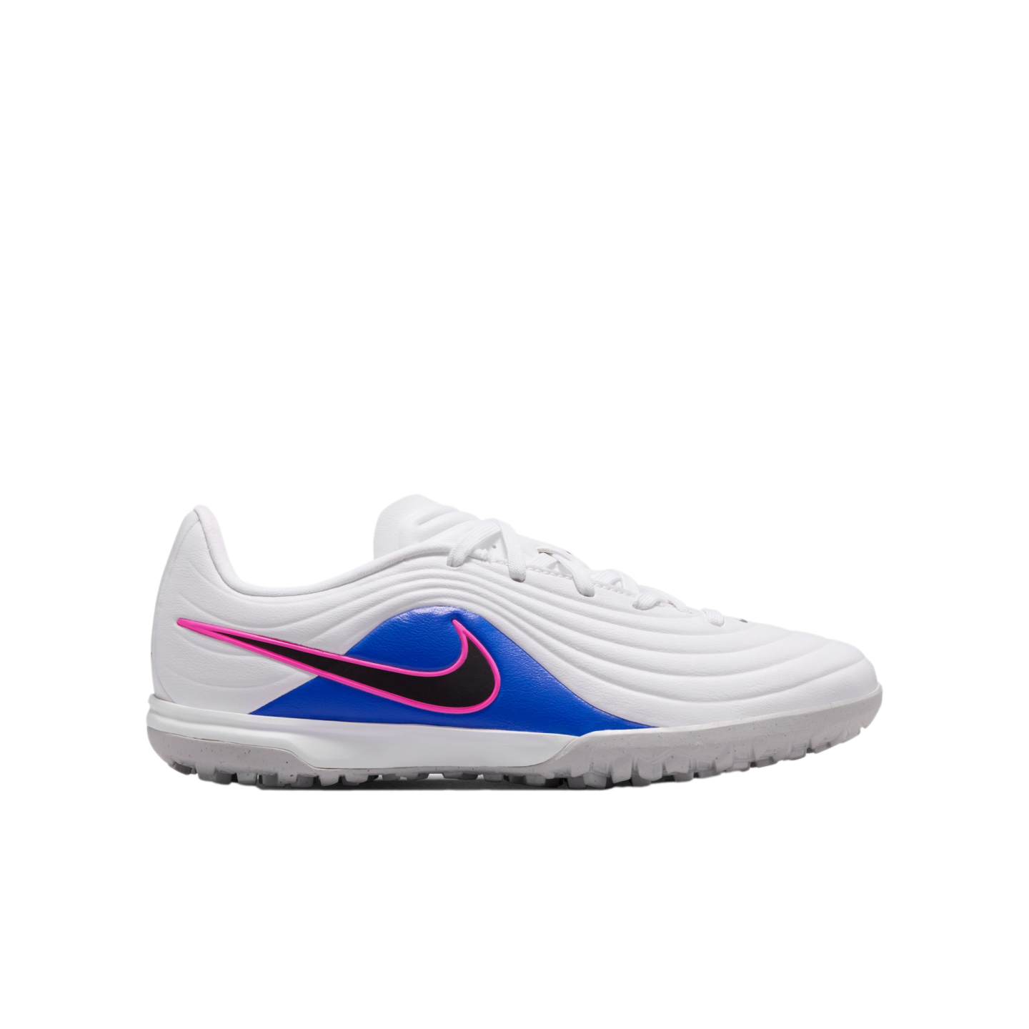A white Nike soccer shoe with blue and pink accents, featuring a black swoosh and a grey textured sole, shown in profile against a black background.