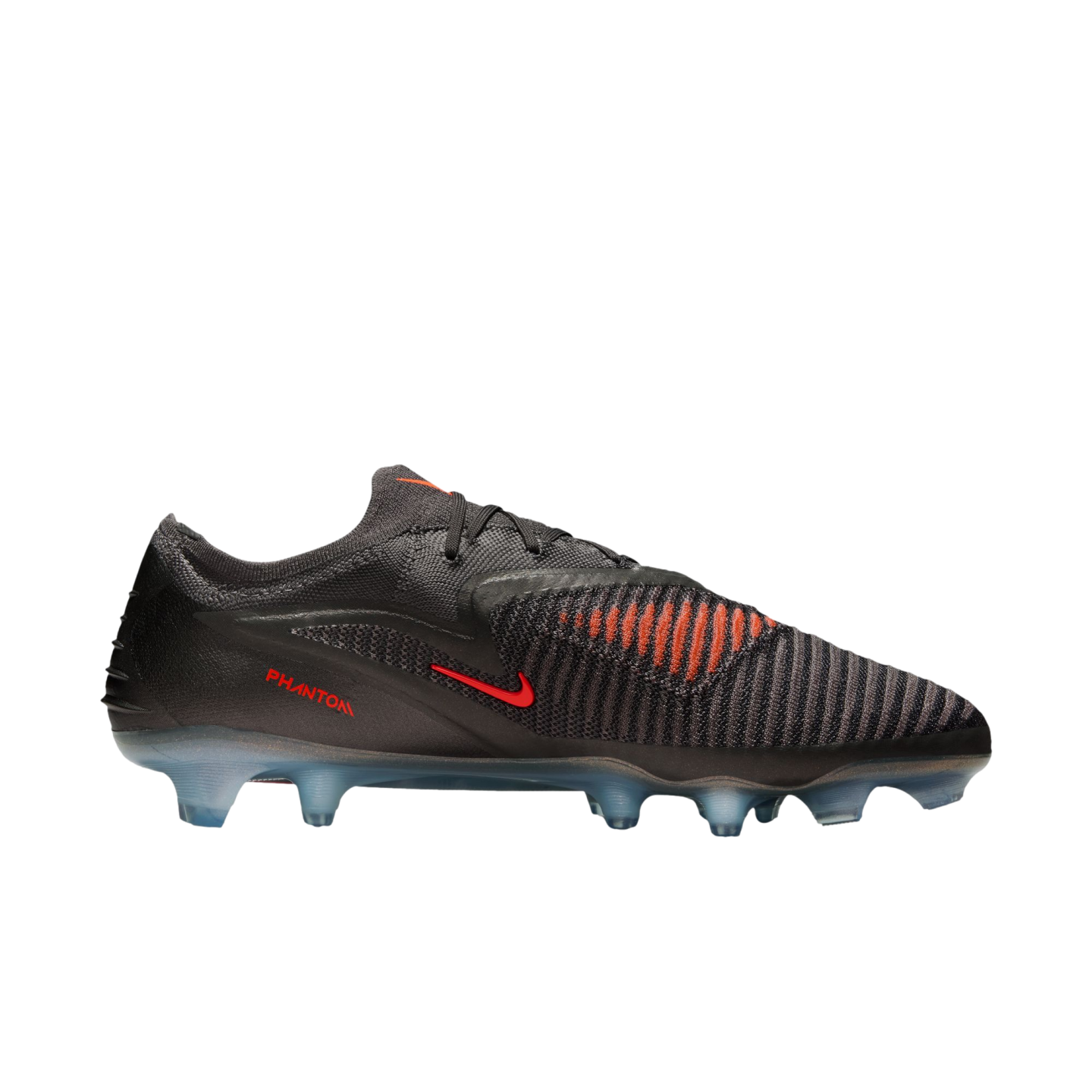 A side view of a dark grey Nike Phantom soccer cleat with red accents and translucent blue studs against a black background.