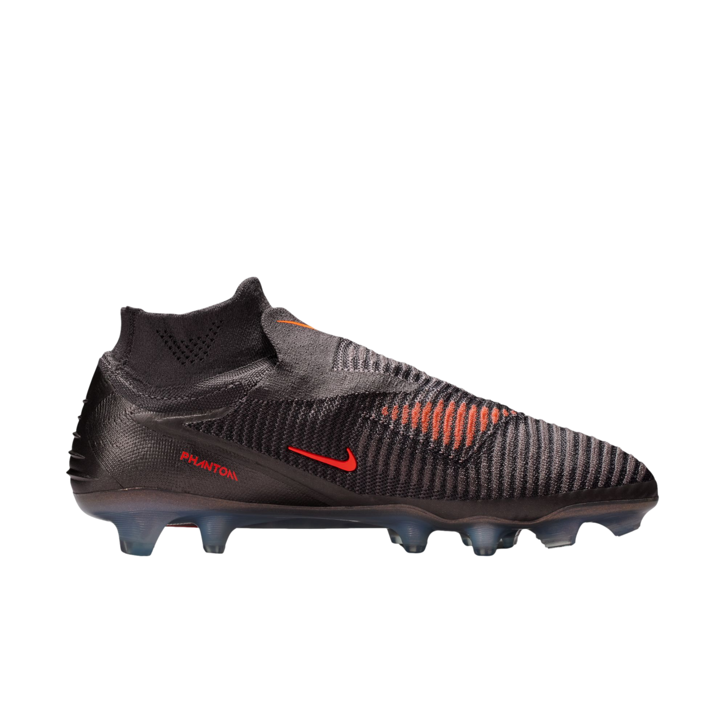 A profile view of a dark grey Nike Phantom soccer cleat with bright orange accents on a solid black background. The shoe features a textured, laceless upper with a high-top collar, a small red swoosh logo, and "PHANTOM" printed in red on the heel. The soleplate is a translucent dark grey with several studs.