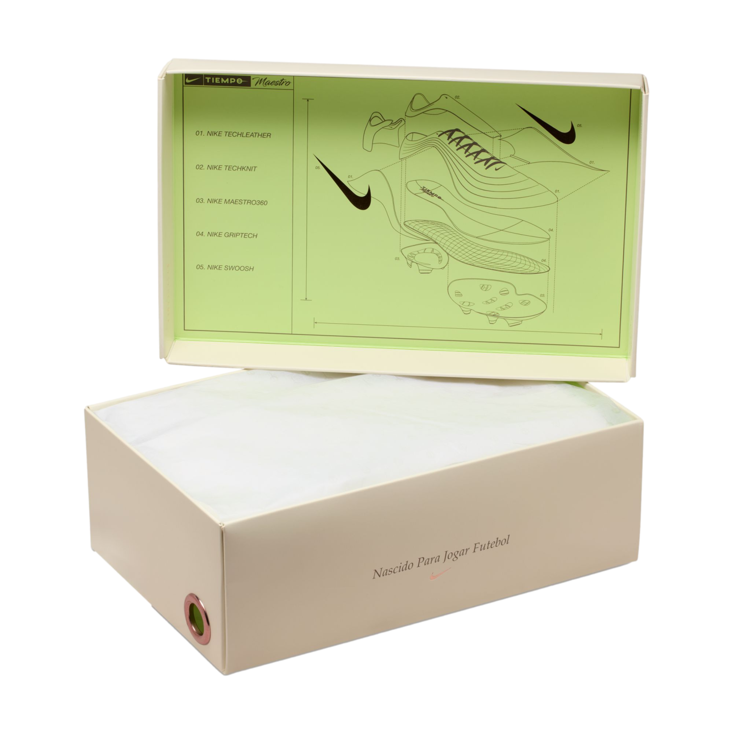Open cream Nike shoebox with a lime green technical diagram of a soccer cleat inside the lid, filled with white tissue paper on a black background.