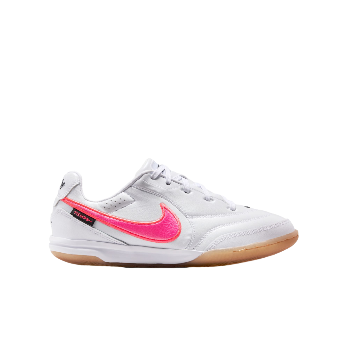 White Nike Tiempo indoor soccer shoe with a vibrant pink swoosh and a gum rubber outsole, shown in profile view against a white background.