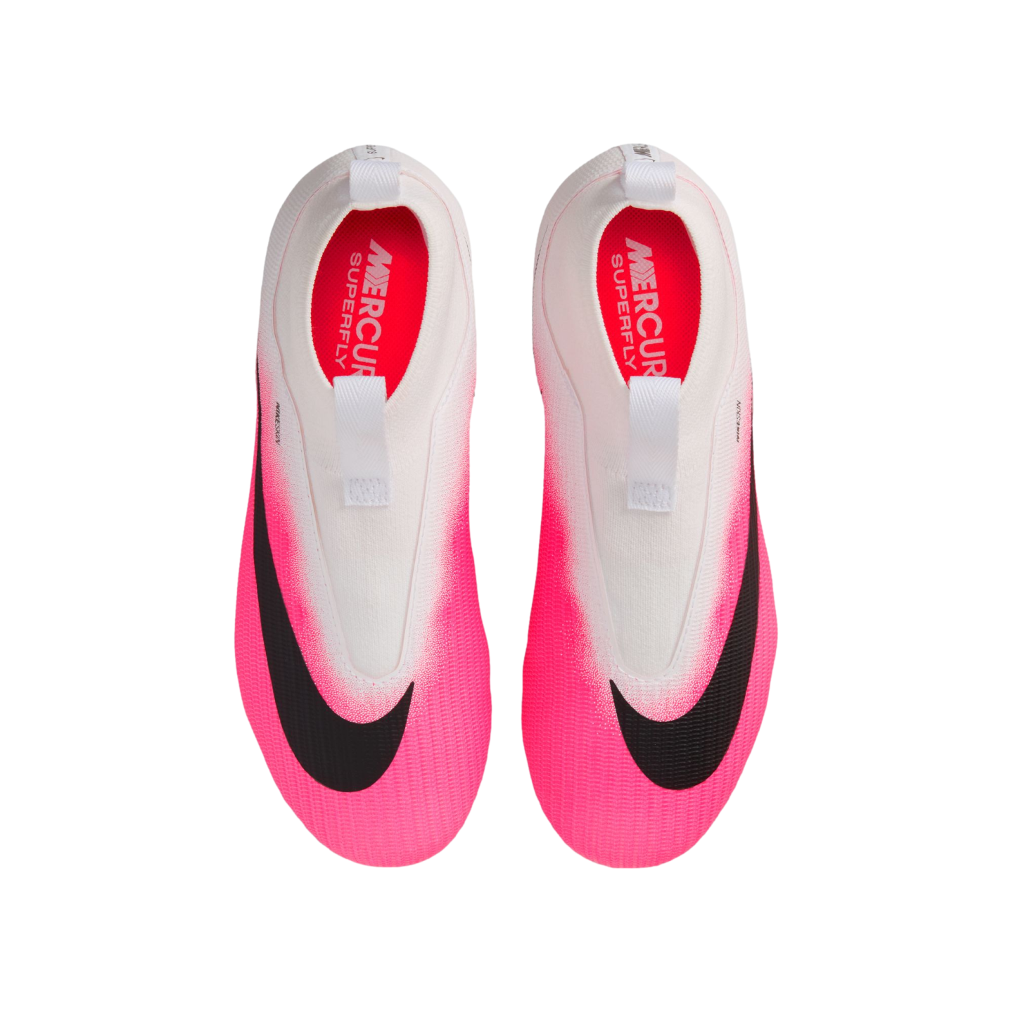 A top-down view of Nike Mercurial Superfly soccer cleats, featuring a white upper fading into bright pink at the toes with large black Nike swooshes.