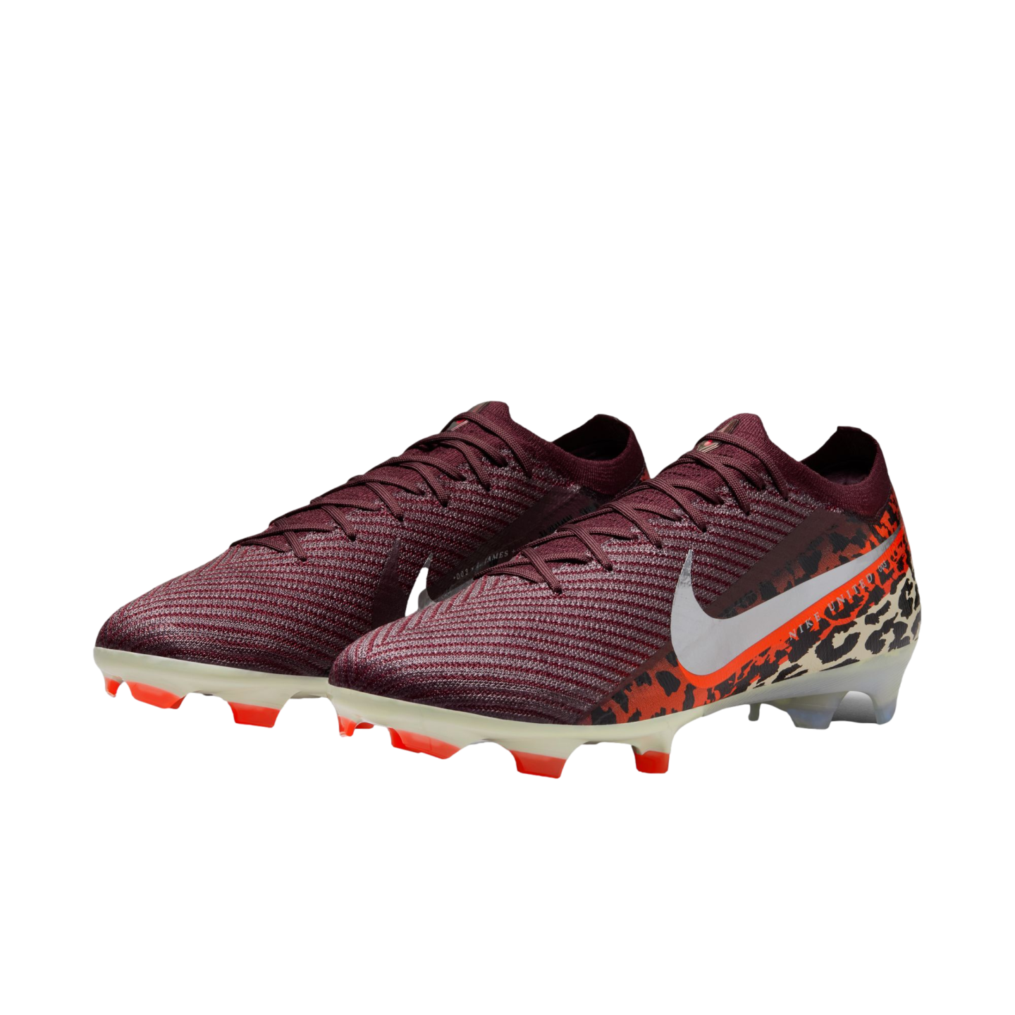 A pair of Nike Mercurial soccer cleats featuring a dark maroon knit upper that transitions into an orange and black leopard print pattern at the heel. A large white Nike swoosh is prominent on the side, and the cream-colored soleplate has bright orange studs. The shoes are set against a solid black background.