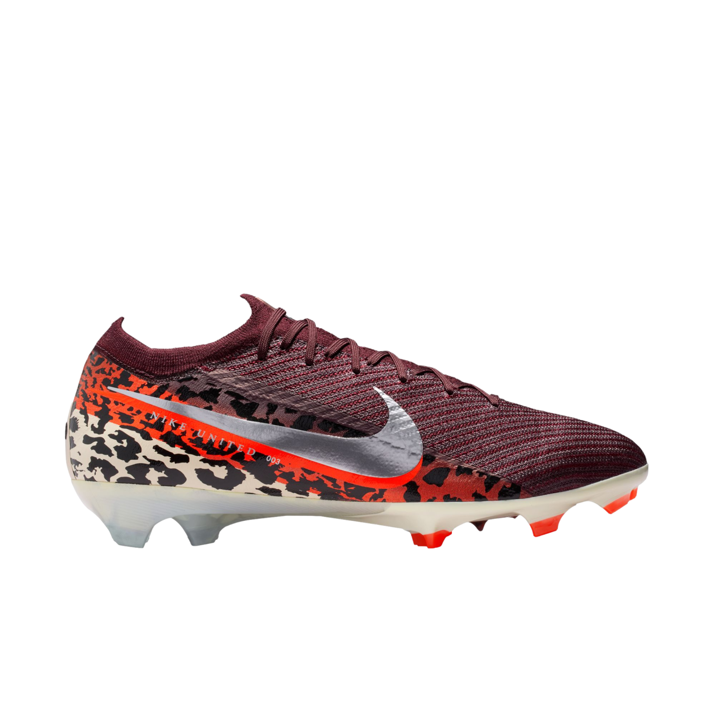 A profile view of a Nike soccer cleat with a burgundy textured upper, a metallic silver swoosh, and a black-and-cream leopard print pattern around the base and heel. A bright orange-red gradient stripe features the text "NIKE UNITED 003". The cleat sits on a translucent cream soleplate with orange studs against a black background.