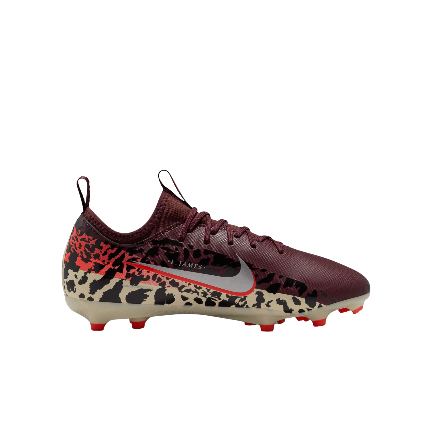 A side-profile view of a Nike soccer cleat against a solid black background. The shoe features a maroon upper with matching laces and a lower section decorated with a tan and black leopard print that transitions into red at the heel. A large silver Nike swoosh with a thin red outline is on the side, with the text "L. JAMES" printed in small white letters above it. The cleat has a translucent cream soleplate with bright red studs.