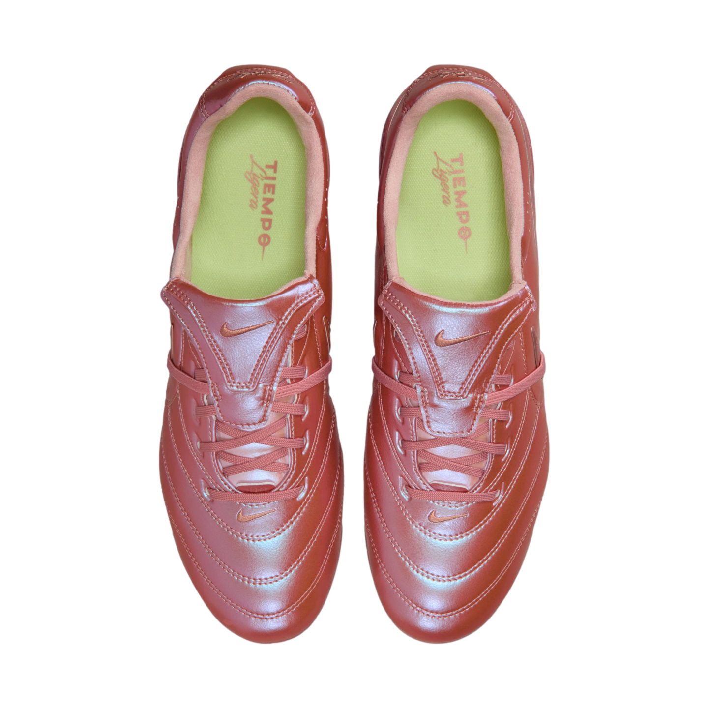 Top-down view of metallic reddish-pink Nike Tiempo Ligera soccer shoes with lime green interiors, isolated on a black background.