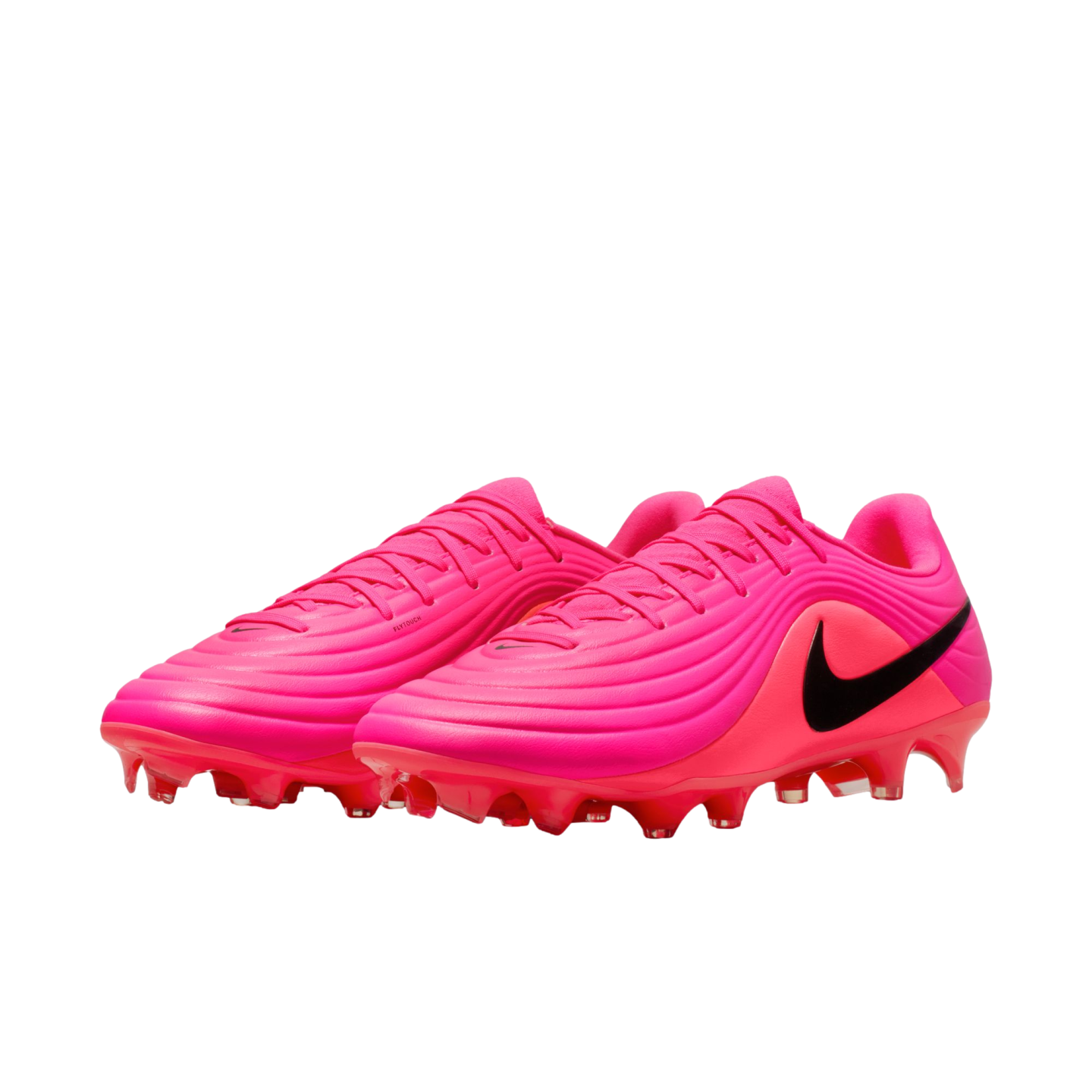 Vibrant neon pink Nike soccer cleats with black swoosh logos and textured, ridged uppers, shown against a white background.